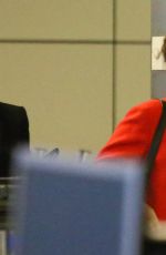 LILY COLLINS Arrives at Los Angeles International Airport
