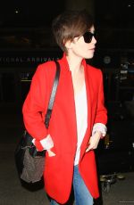 LILY COLLINS Arrives at Los Angeles International Airport