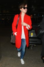 LILY COLLINS Arrives at Los Angeles International Airport
