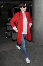 LILY COLLINS Arrives at Los Angeles International Airport
