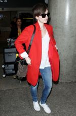 LILY COLLINS Arrives at Los Angeles International Airport