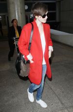 LILY COLLINS Arrives at Los Angeles International Airport