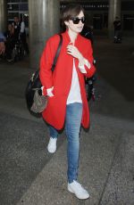 LILY COLLINS Arrives at Los Angeles International Airport