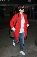 LILY COLLINS Arrives at Los Angeles International Airport