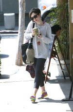 LILY COLLINS at Earth Bar in West Hollywood