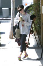 LILY COLLINS at Earth Bar in West Hollywood