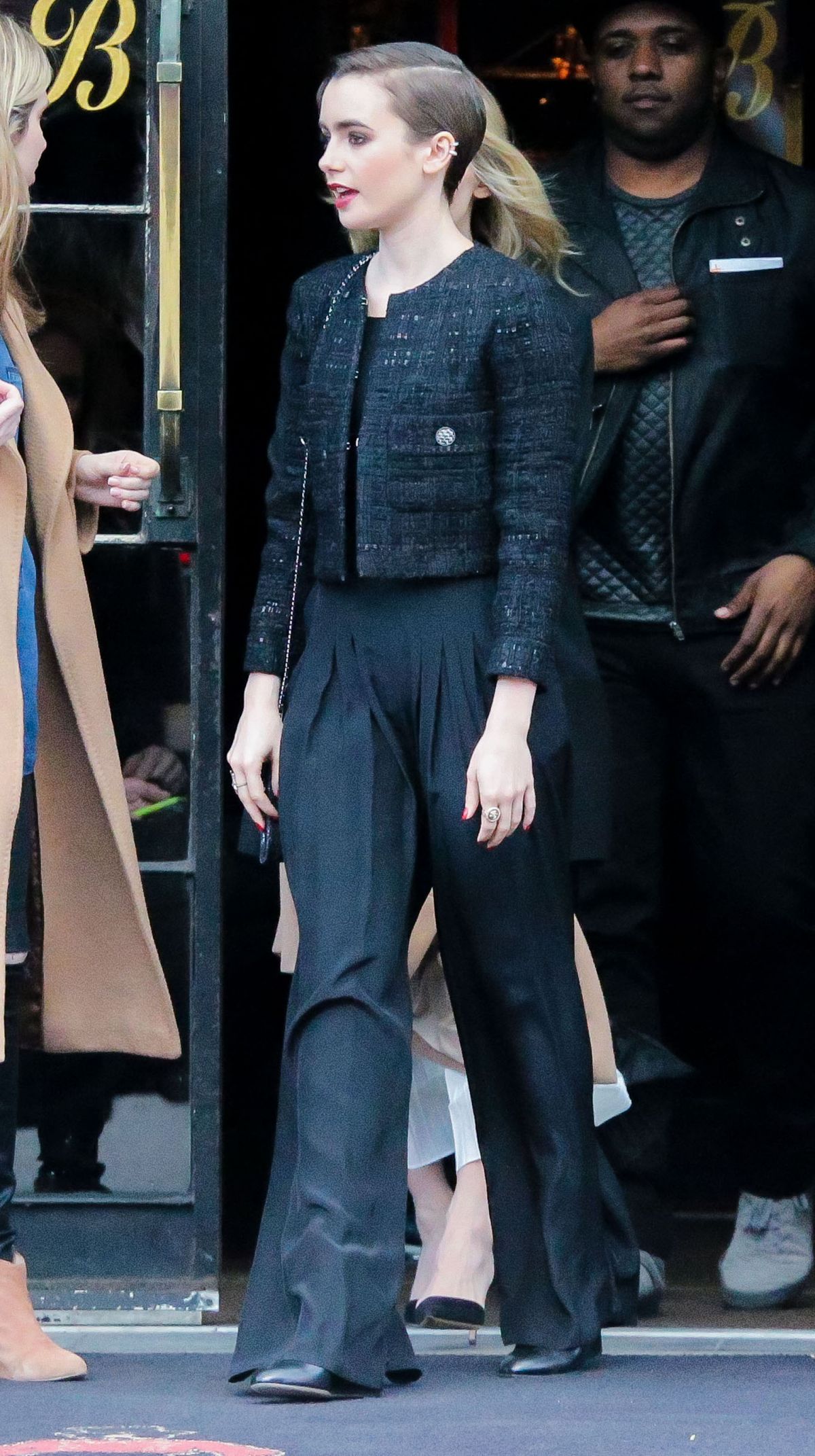 LILY COLLINS Leaves Her Hotel in New York LILY COLLINS Leaves Her Hotel in New York