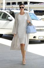 MIRANDA KERR Arrives at Los Angeles International Airport