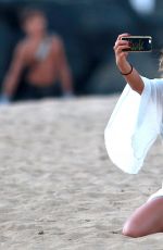 NICOLE SCHERZINGER Taking a Selfie on the Beach in Hawaii