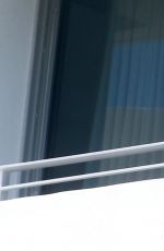 REESE WITHERSPOON at a Hotel Balcony in Miami 04/20/2015