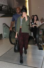 SELENA GOMEZ Arrives at Los Angeles International Airport
