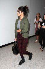 SELENA GOMEZ Arrives at Los Angeles International Airport