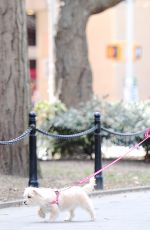 VANESSA HUDGENS Walks Her Dog at Washington Square Park in New York