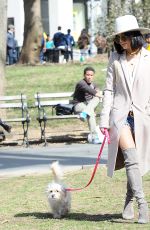 VANESSA HUDGENS Walks Her Dog at Washington Square Park in New York