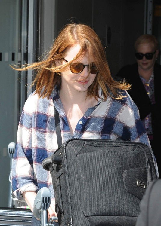 EMMA STONE Arrives at Heathrow Airport in London