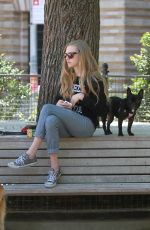 AMANDA SEYFRIED Out for a Walk with Her Dog Finn in New York 05/23/2015
