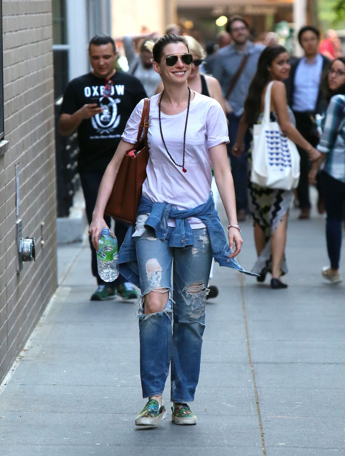 ANNE HATHAWAY in Ripped Jeans Out and About in Manhattan 05/08/2015