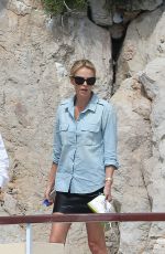 CHARLIZE THERON at Eden Roc Hotel Pool in Cannes