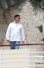 CHARLIZE THERON at Eden Roc Hotel Pool in Cannes