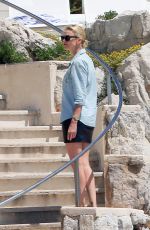 CHARLIZE THERON at Eden Roc Hotel Pool in Cannes