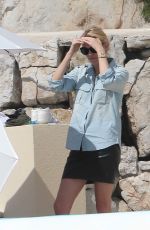 CHARLIZE THERON at Eden Roc Hotel Pool in Cannes