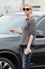 CHARLIZE THERON Out and About in Hollywood 05/26/2015