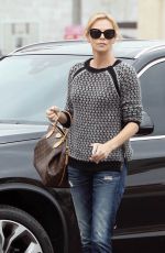 CHARLIZE THERON Out and About in Hollywood 05/26/2015