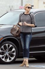 CHARLIZE THERON Out and About in Hollywood 05/26/2015