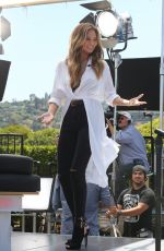 CHRISSY TEIGEN on the Set of Extra in Los Angeles