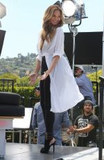 CHRISSY TEIGEN on the Set of Extra in Los Angeles