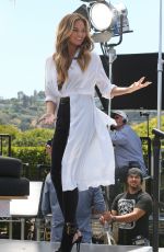 CHRISSY TEIGEN on the Set of Extra in Los Angeles