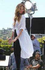 CHRISSY TEIGEN on the Set of Extra in Los Angeles