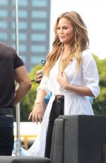 CHRISSY TEIGEN on the Set of Extra in Los Angeles