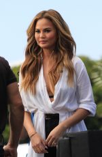 CHRISSY TEIGEN on the Set of Extra in Los Angeles