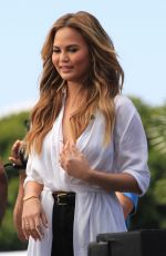 CHRISSY TEIGEN on the Set of Extra in Los Angeles