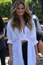 CHRISSY TEIGEN on the Set of Extra in Los Angeles