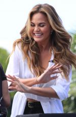 CHRISSY TEIGEN on the Set of Extra in Los Angeles