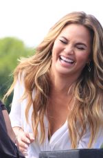 CHRISSY TEIGEN on the Set of Extra in Los Angeles