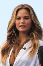 CHRISSY TEIGEN on the Set of Extra in Los Angeles