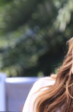 CHRISSY TEIGEN on the Set of Extra in Los Angeles
