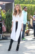 CHRISSY TEIGEN on the Set of Extra in Los Angeles