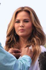 CHRISSY TEIGEN on the Set of Extra in Los Angeles