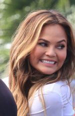CHRISSY TEIGEN on the Set of Extra in Los Angeles