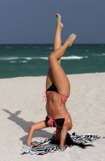 CLAUDIA ROMANI in Bikini at a Beach in Miami 05/17/2015