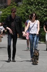 DAKOTA JOHNSON Walks Her Dog Out in New York 05/24/2015
