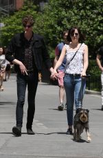 DAKOTA JOHNSON Walks Her Dog Out in New York 05/24/2015