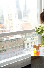 KATIE HOLMES at Alterna Haircare