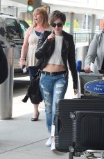 LILY COLLINS in Ripped Jeans at JFK Airport 05/05/2015