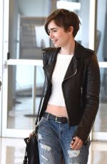 LILY COLLINS in Ripped Jeans at JFK Airport 05/05/2015