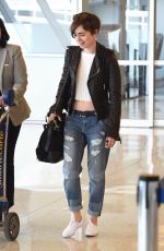 LILY COLLINS in Ripped Jeans at JFK Airport 05/05/2015